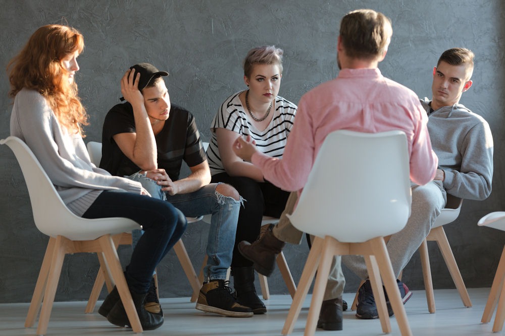 prescription-drug-addiction-treatment Group therapy session for prescription drug addiction.